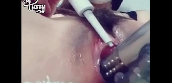  Brunette girl in mask masturbates with vibrator